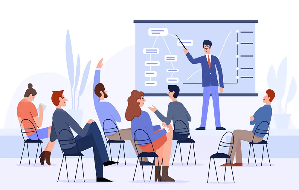 employees sitting in a room during a lecture